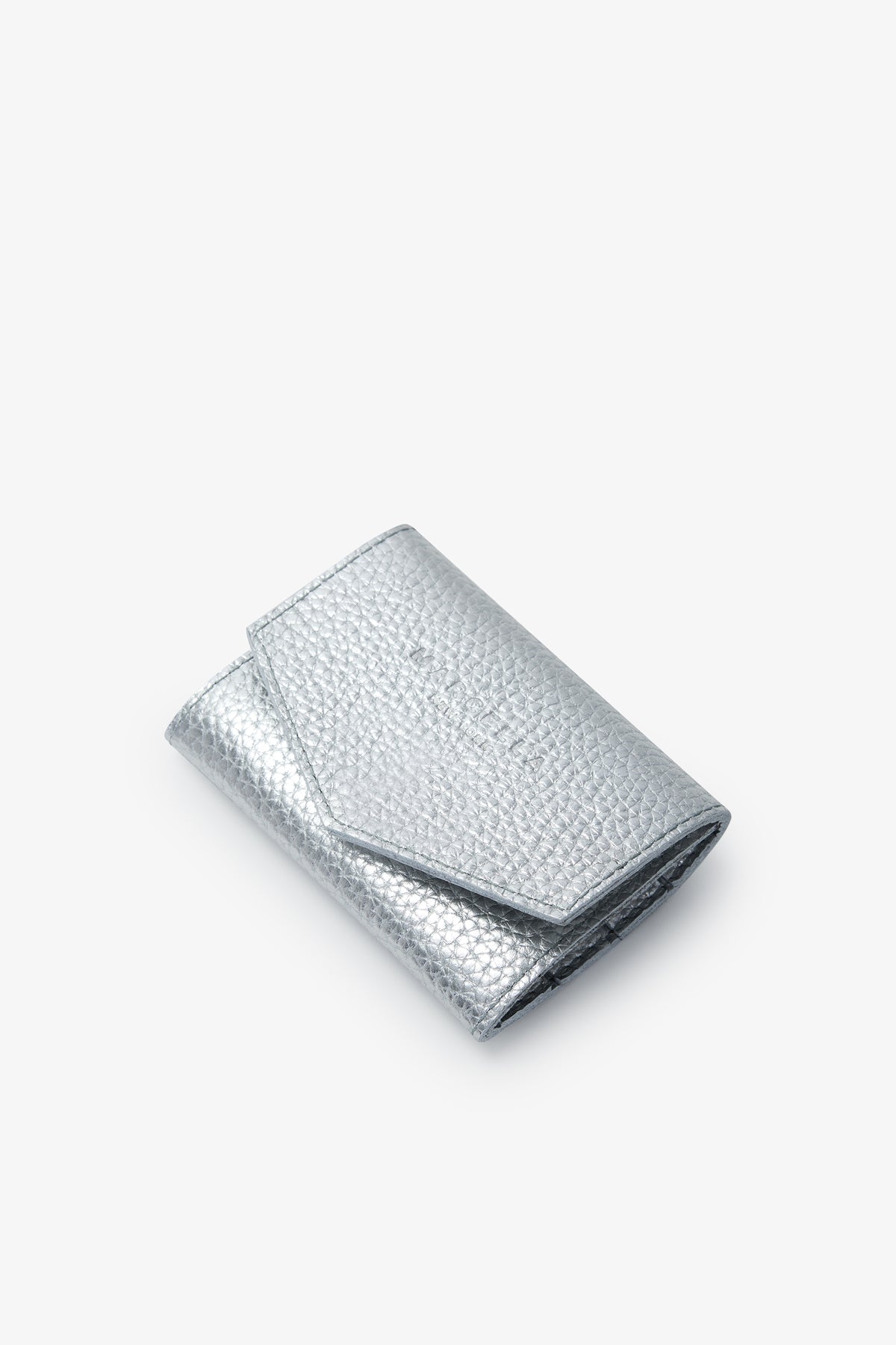 Silver metallic jewelry pouch with textured quilted surface and fold-over flap closure.