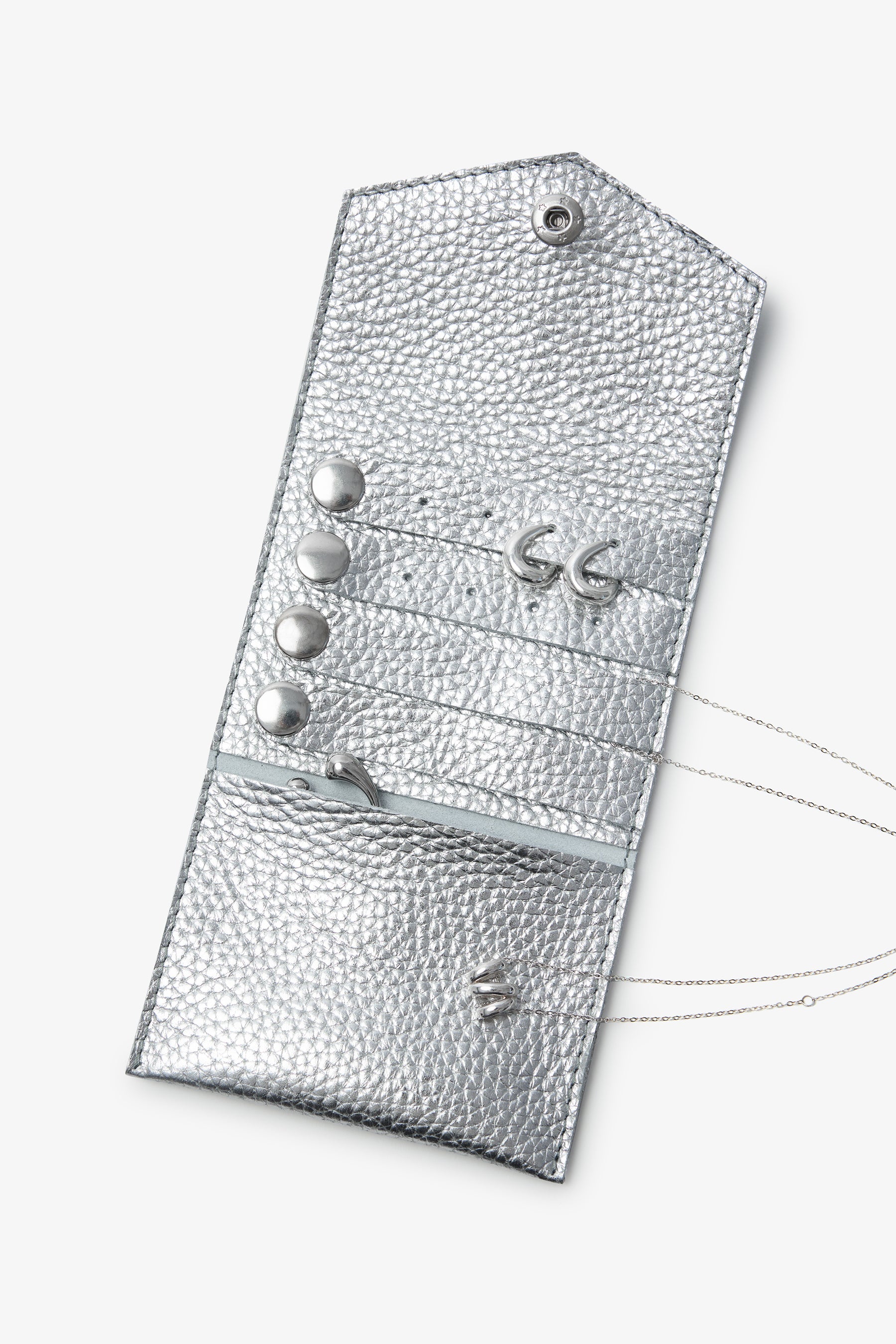 Silver metallic jewelry pouch with textured surface, metal snaps, and chain strap.