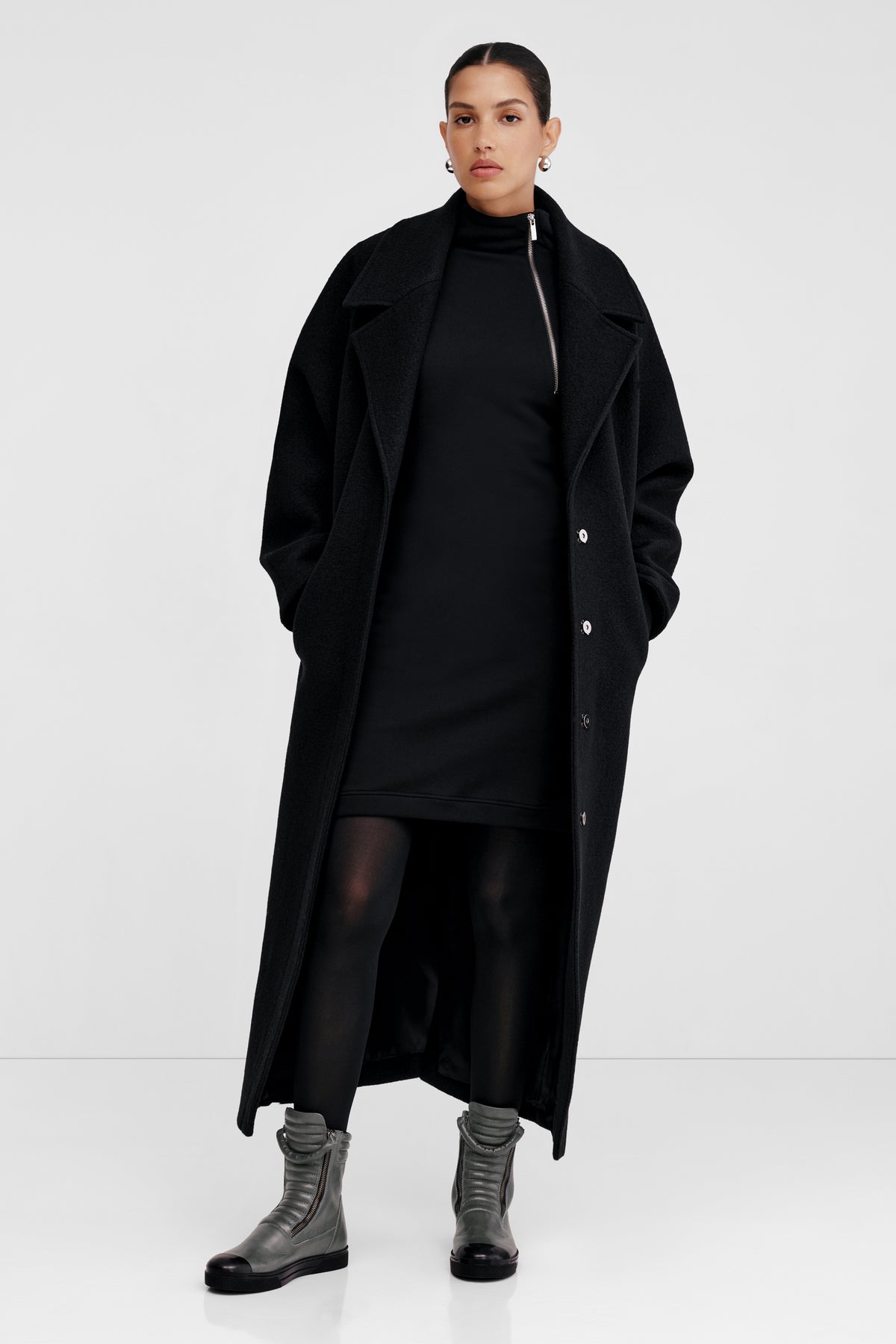 Black work dress with grey knee high boots and coat