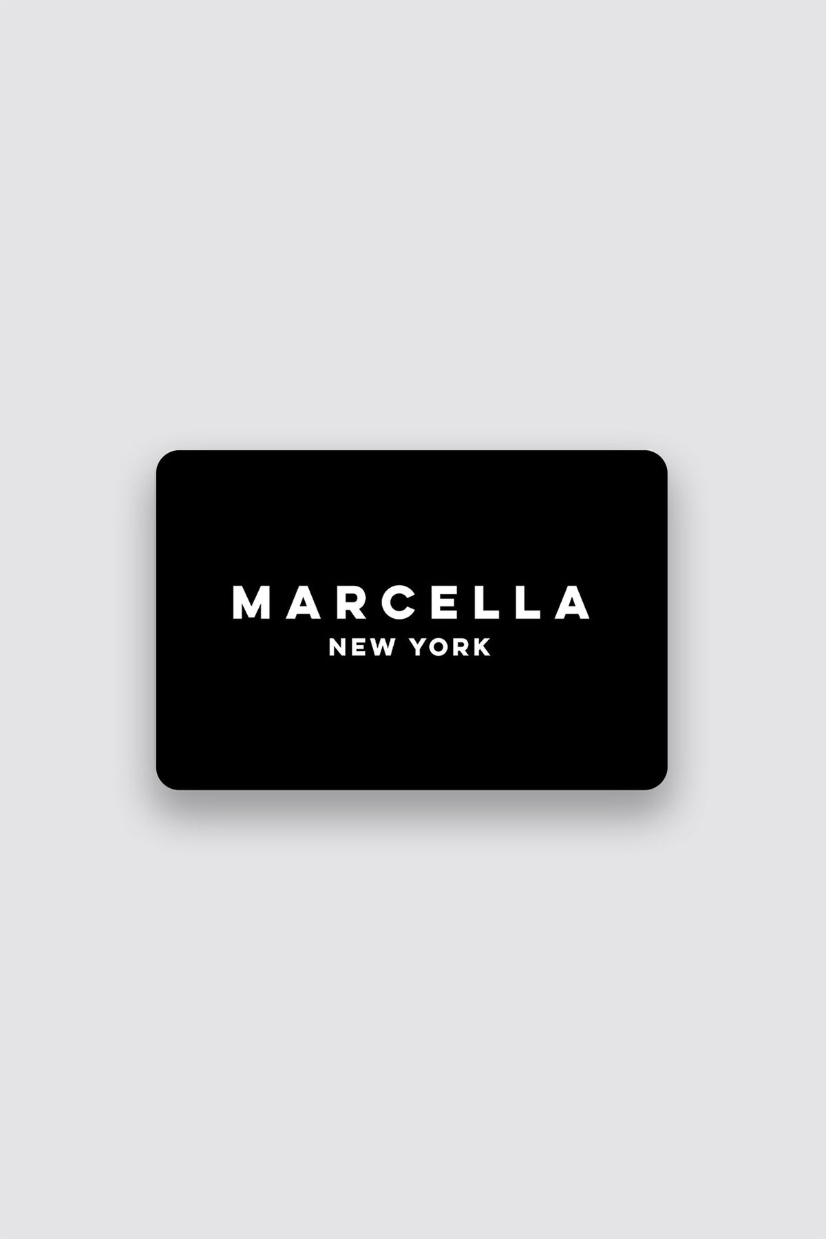 Black rounded rectangle card with white text reading "MARCELLA NEW YORK" on gray background.