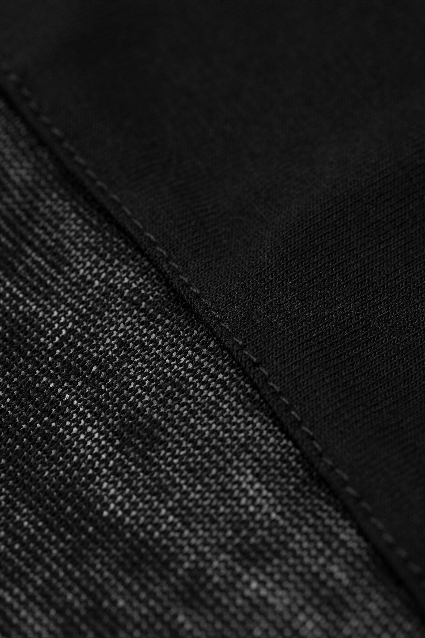 Black skirted leggings with textured knit fabric and visible seam detail.